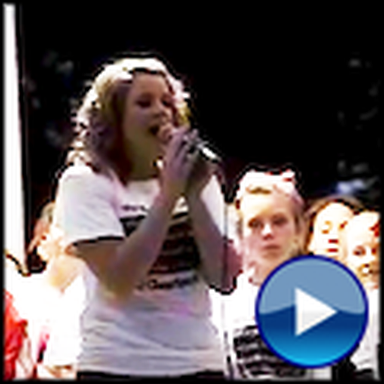 Christian Cheerleader Sings at a Rally Praising God