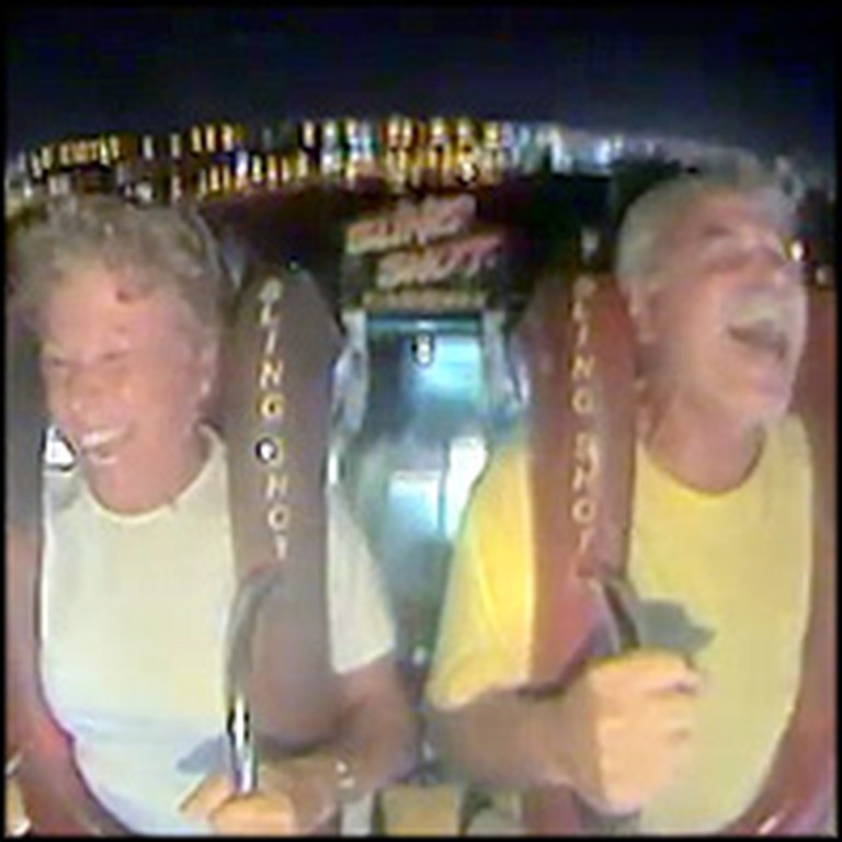 Older Couple Has a Blast on a Amusement Park Ride