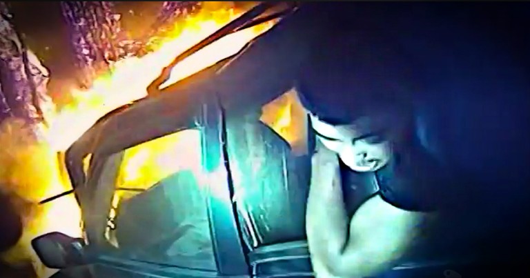 Terrifying Bodycam Footage Of A Police Officer Rescuing A Man From A Burning Car 