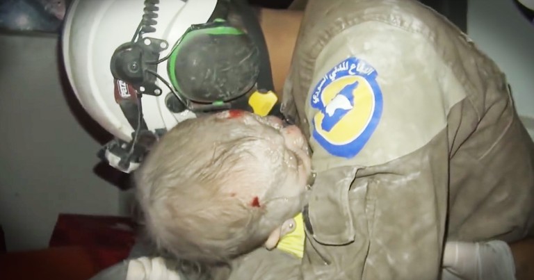 Rescuer Sobbs As The Baby He Rescued Comes Back To Life In His Arms