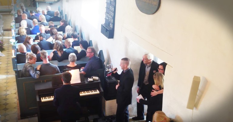 Young Man Sing's Touching Version Of 'You Raise Me Up' At His Big Brother's Funeral