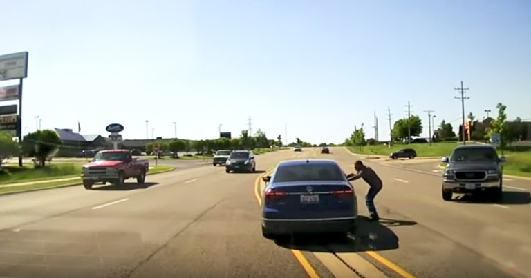 Man Jumps Into Moving Car To Save Driver Having A Seizure