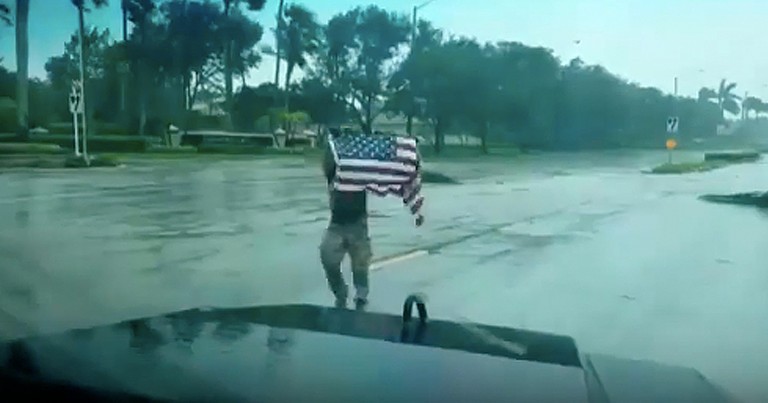 First Responder Rescuing Fallen American Flag During Hurricane Goes Viral