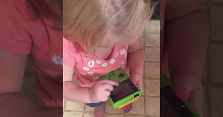 Adorable Toddler Can't Figure Out How To Play Gameboy