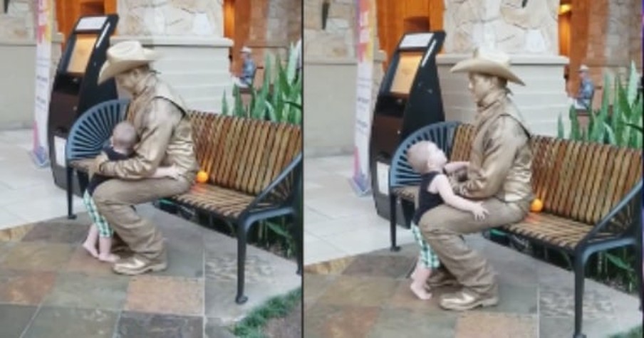 Sweet Child Goes to Hug a Living Statue and the Man Simply Couldn't Resist Breaking Character