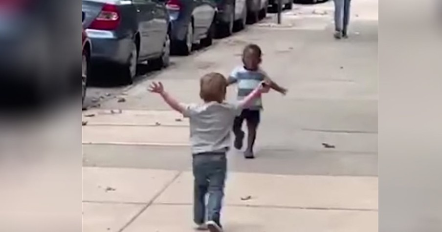 Two Toddler Best Friends Run To Embrace Each Other On The Street