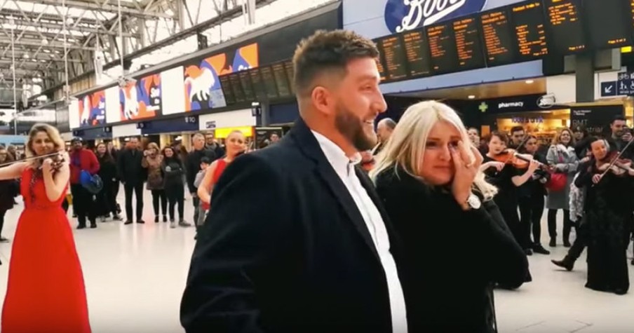 Flash Mob Surprise Orchestra Proposal At Busy Train Station