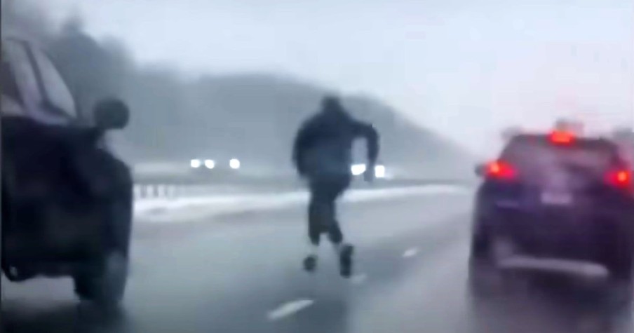 Man Races Around To Dodge Traffic So He Can Help A Man In Danger