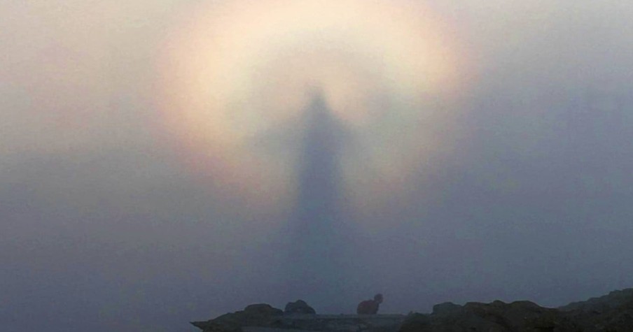 Man Snaps Photo During Sunrise And Sees A Figure In The Clouds