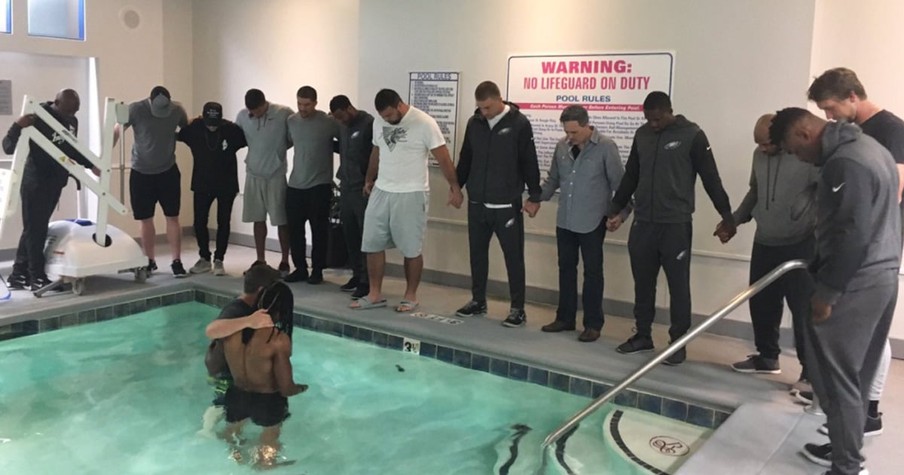 NFL Football Player Gets Baptized Surrounded By His Teammates