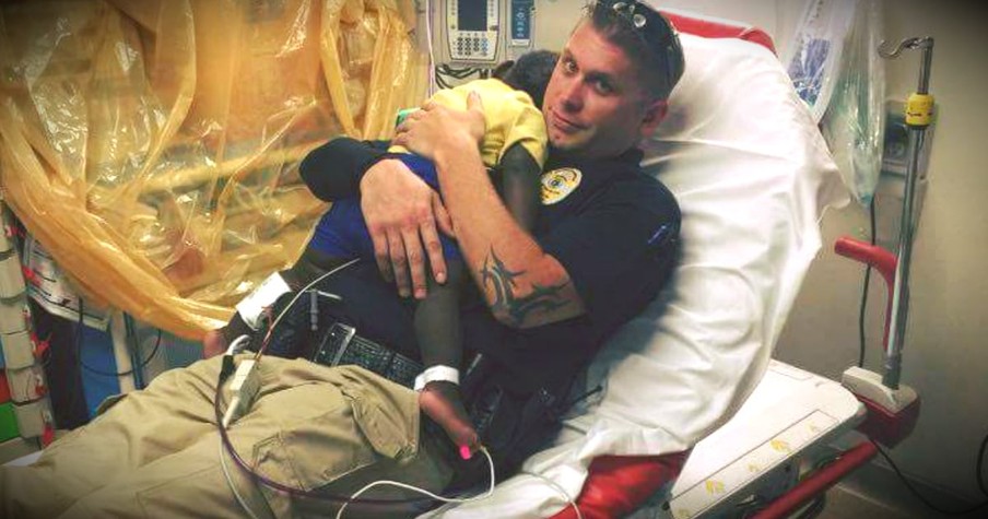 Photo Of A Police Officer Snuggling An Abandoned Toddler Goes Viral