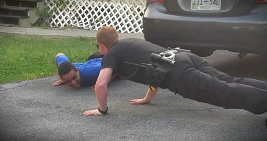 Police Officer Gets Down In Driveway To Calm An Upset Boy With Autism