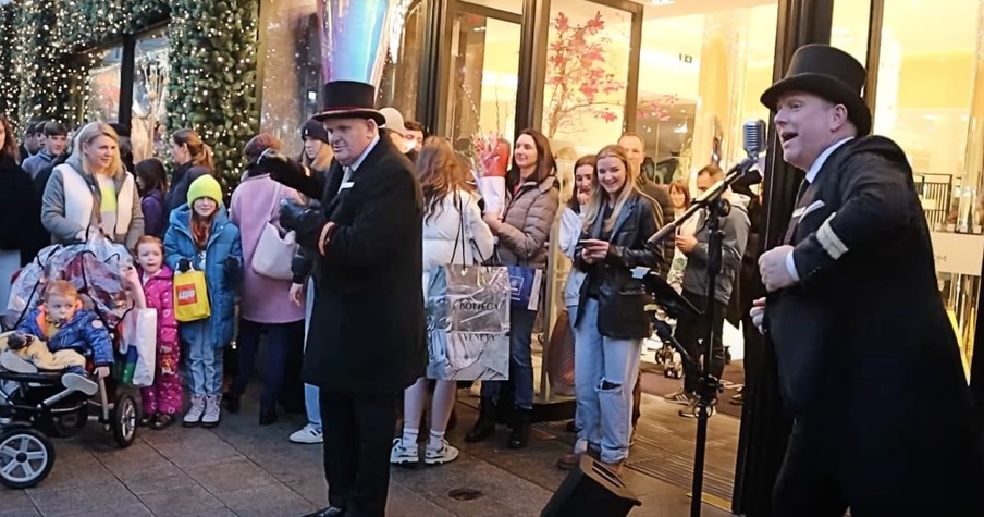 Sean the Singing Doorman Spreads Holiday Cheer & Greets Customers with 'White Christmas'