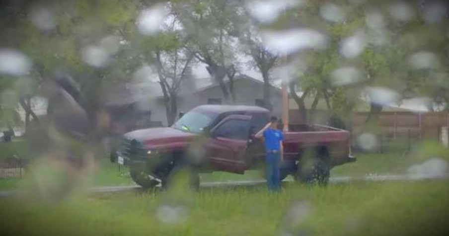 Stranger Stands In The Pouring Rain To Salute A Fallen Veteran