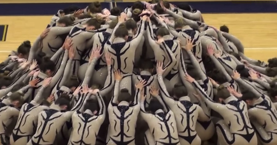 Dancers Fall To The Floor And Then Mesmerize Everyone With Synchronized High Kick Routine