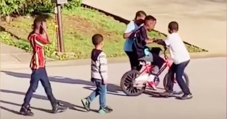 The Neighborhood Kids Help Boy Ride His Bike And It's A Reminder Of The Beauty Of Humanity