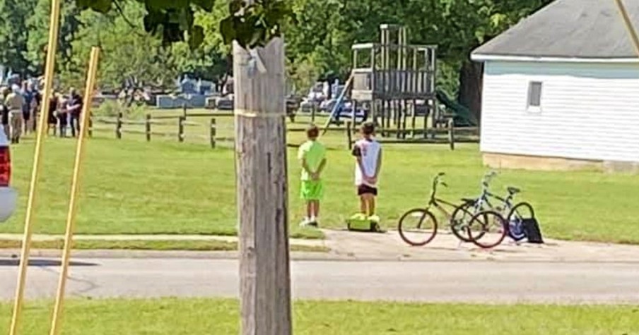 2 Boys Spot Procession for Veteran's Funeral and Immediately Stop Riding Bikes to Pay Respect