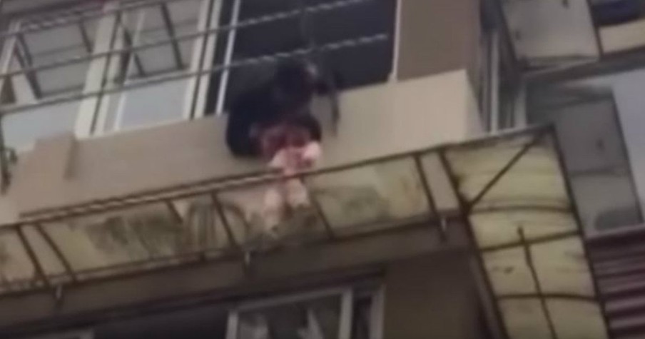 Toddler Was Dangerously Dangling On The Edge Of A Balcony Then Strangers Saved Her