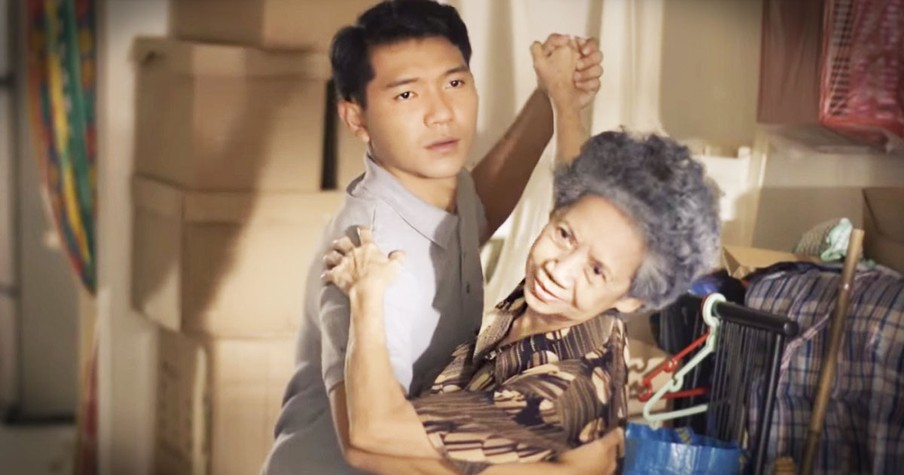 Man Dances With Elderly Woman In Retirement Home