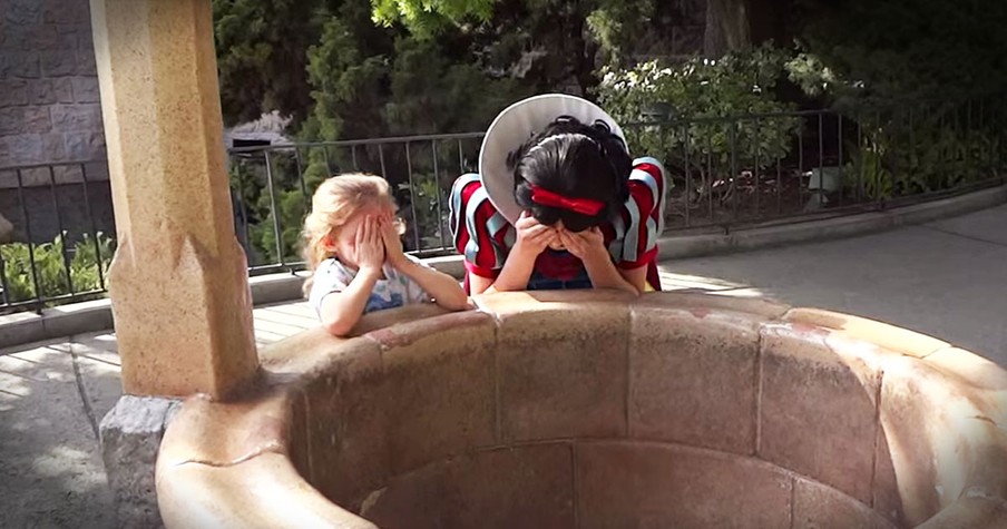 Toddler Is Surprised By Her Daddy At Snow White's Wishing Well