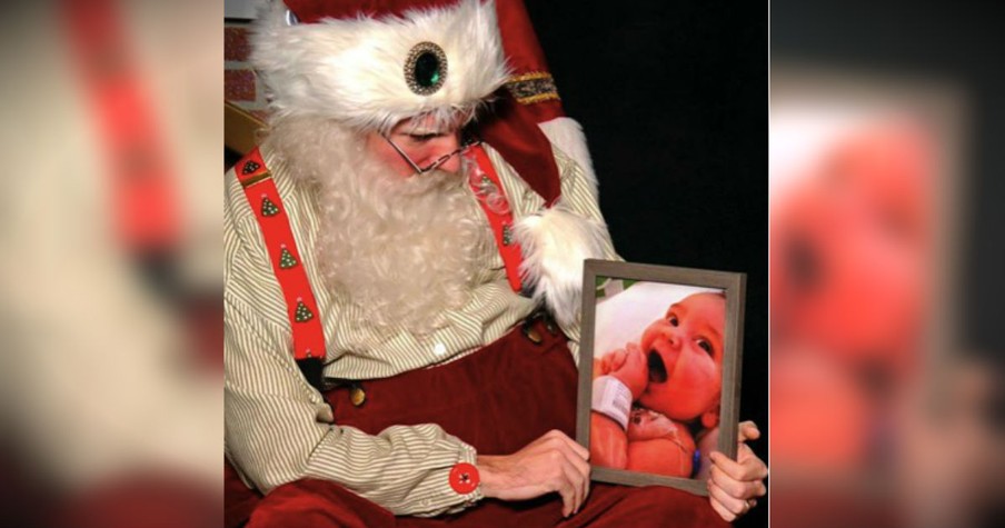 Man Hands Santa A Framed Picture Of The Son He Lost