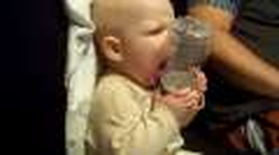 Kaydon playing with a water bottle