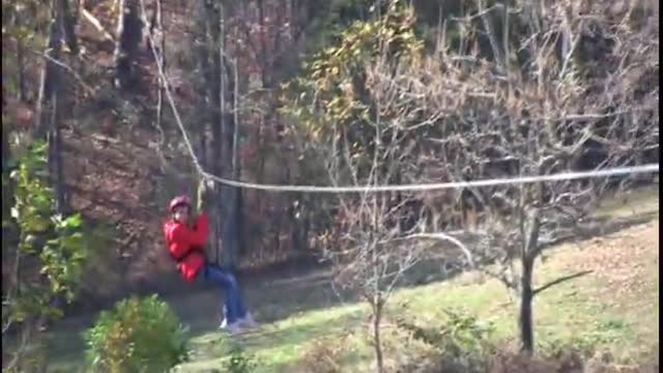 Kat rides the zipline