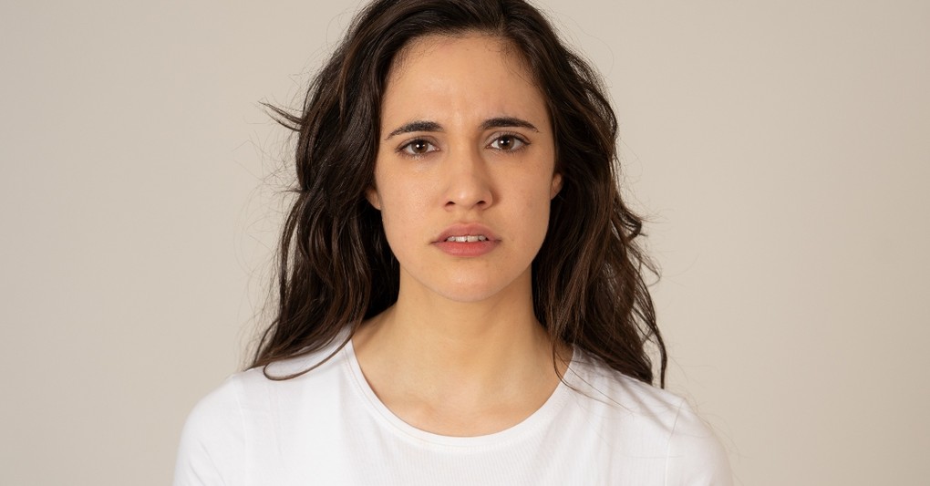 woman staring into camera looking worried and unsure, scriptures to read when you don't know who you are