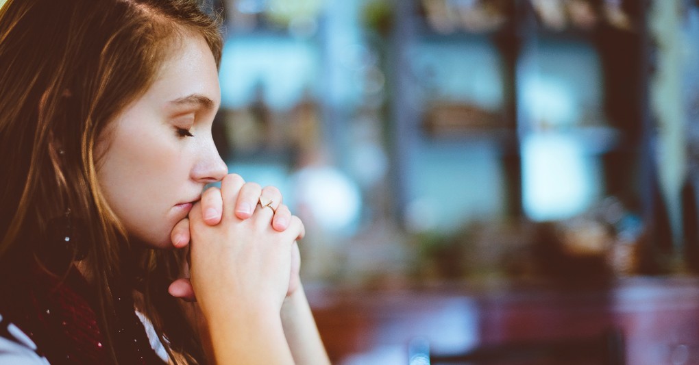 woman praying in faith, warnings against making religion your god