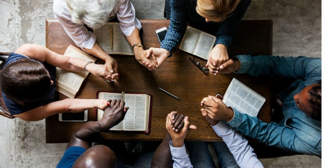 family praying in church