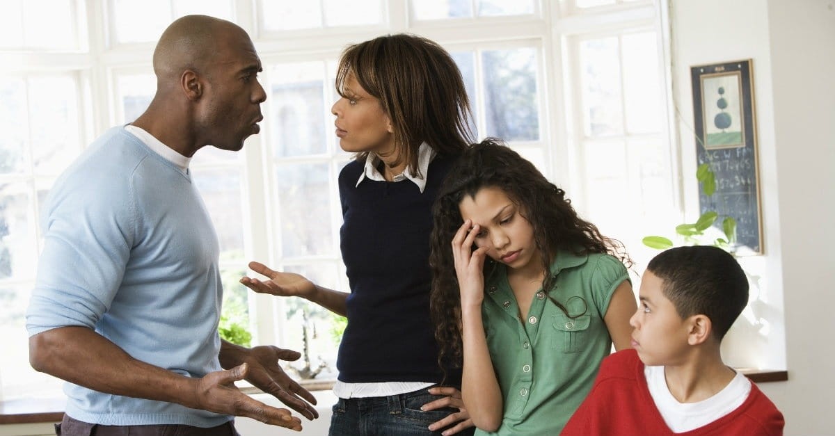 couple arguing in front of kids