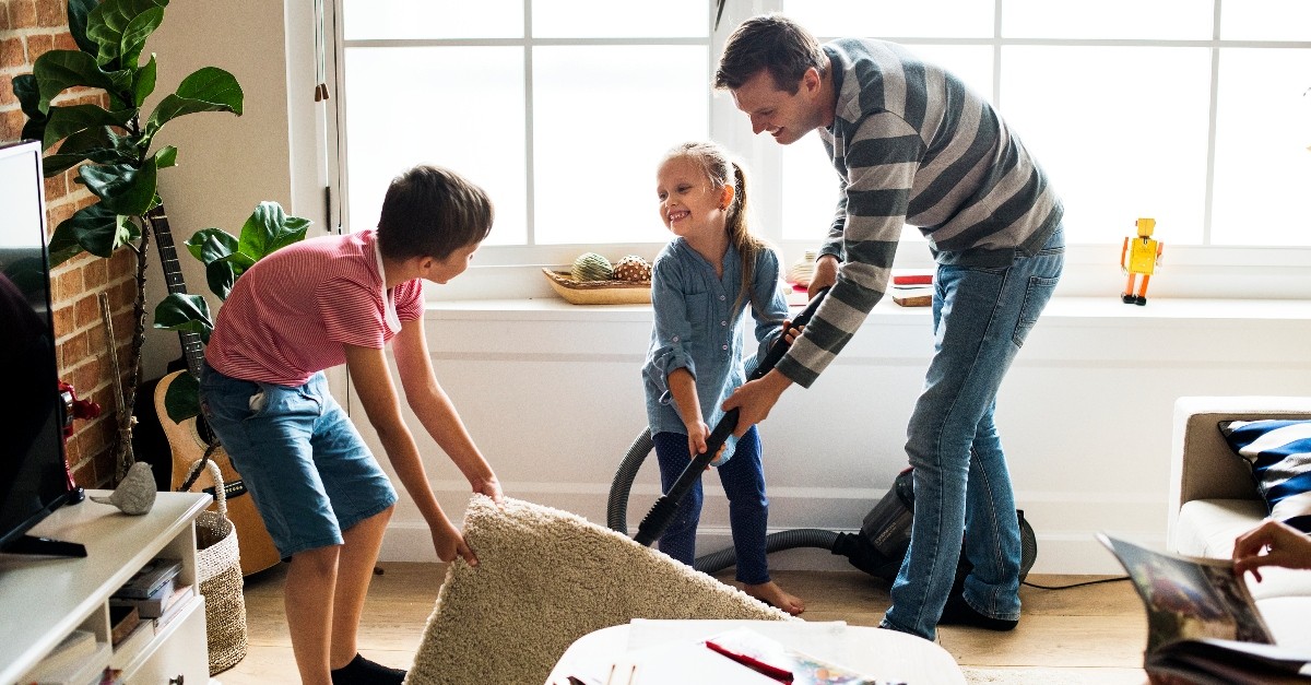 dad and children cleaning