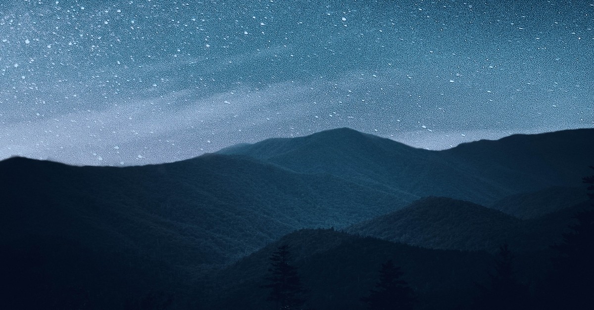 beautiful starry night sky with hills in the background