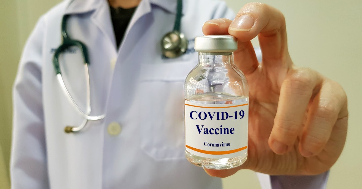 Doctor holding a covid-19 vaccine bottle