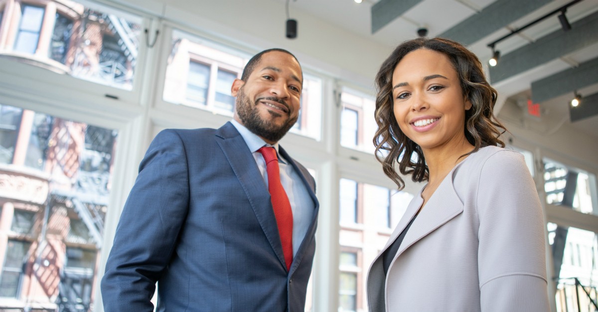man and woman in work suits leadership