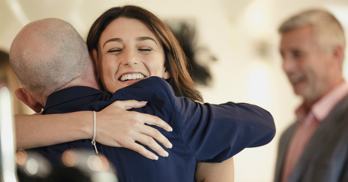 Woman and man hugging in church