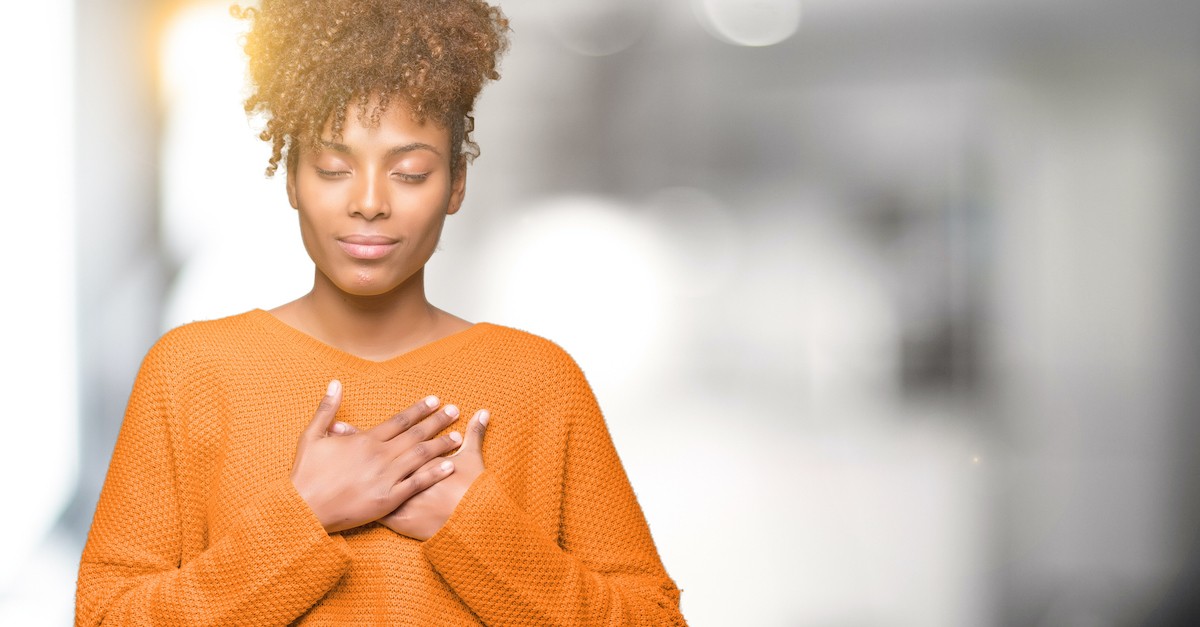 grateful woman praying out of thankfulness