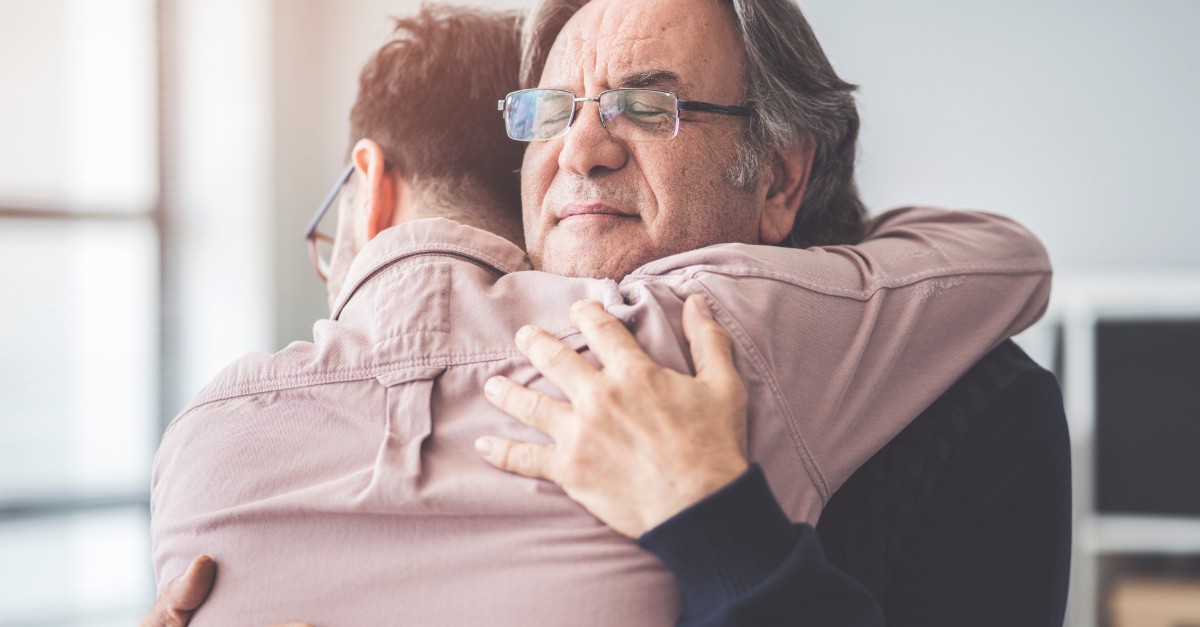 adult son hugging dad fathers day forgiveness