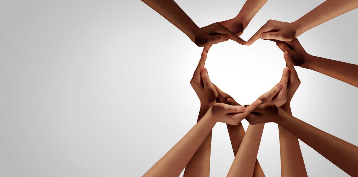 multicultural hands forming heart healing racism