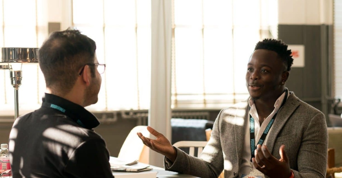 two diverse men having conversation