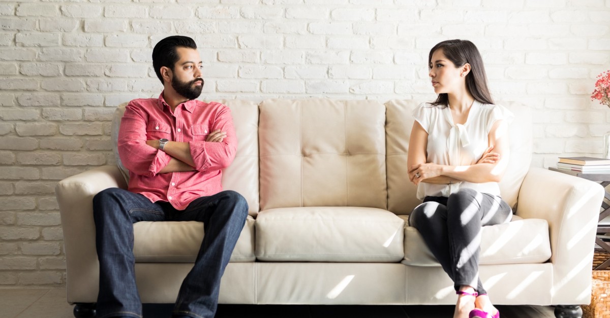 disputed couple staring at each other in disagreement