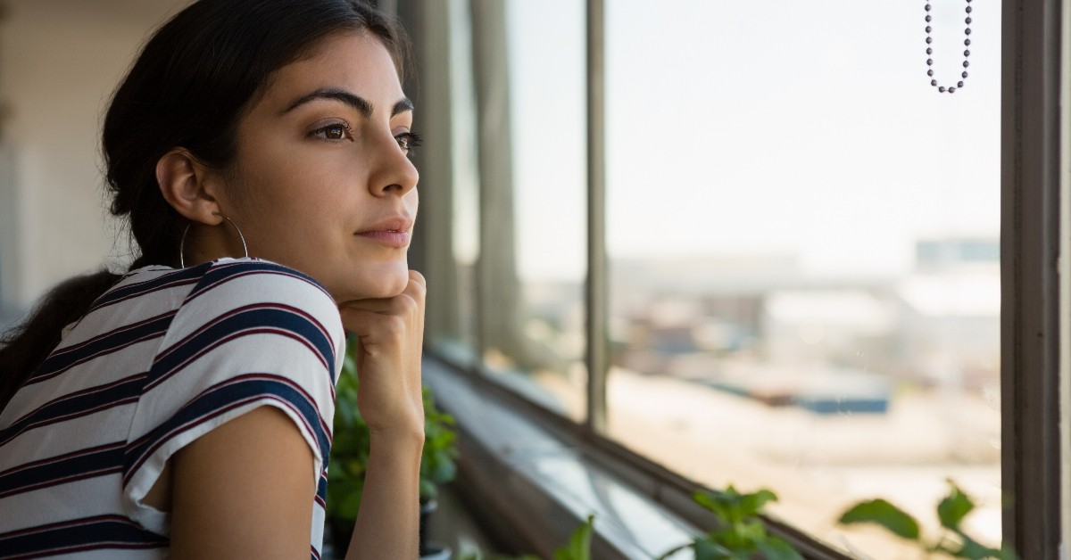 young woman looking wistfully out a window, for those who haven't done great things for God