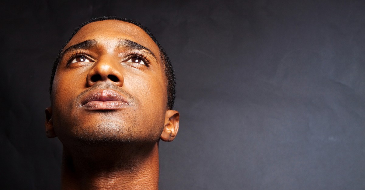 man looking up in prayer