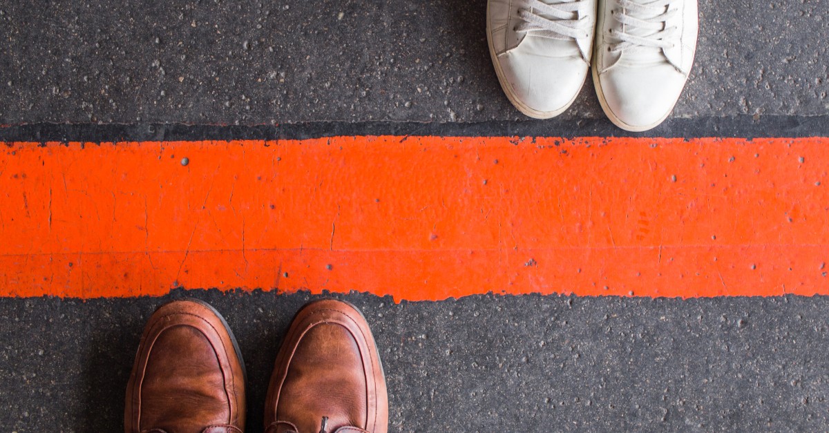 two sets of shoes divided by red line