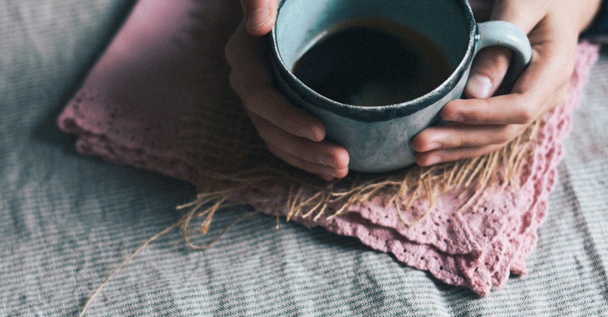 woman's hands holding cup of coffee, prayer for new purpose new day