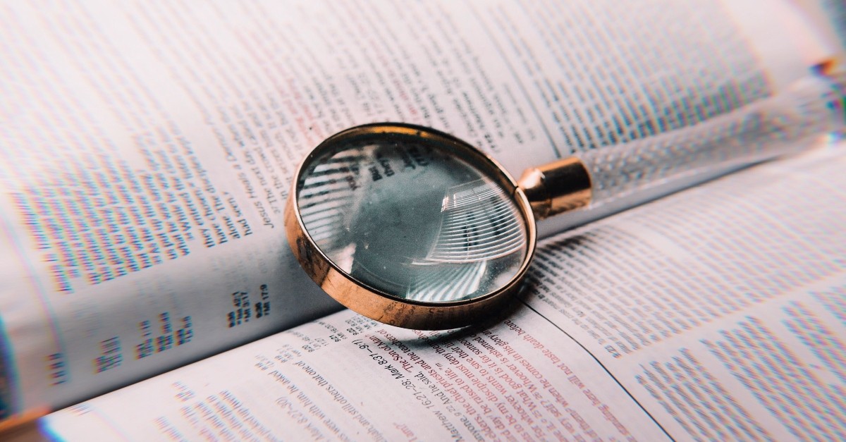 Bible and magnifying glass