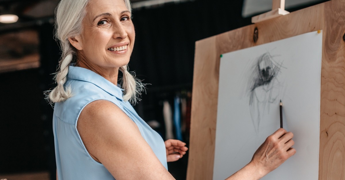 senior woman creating art in retirement