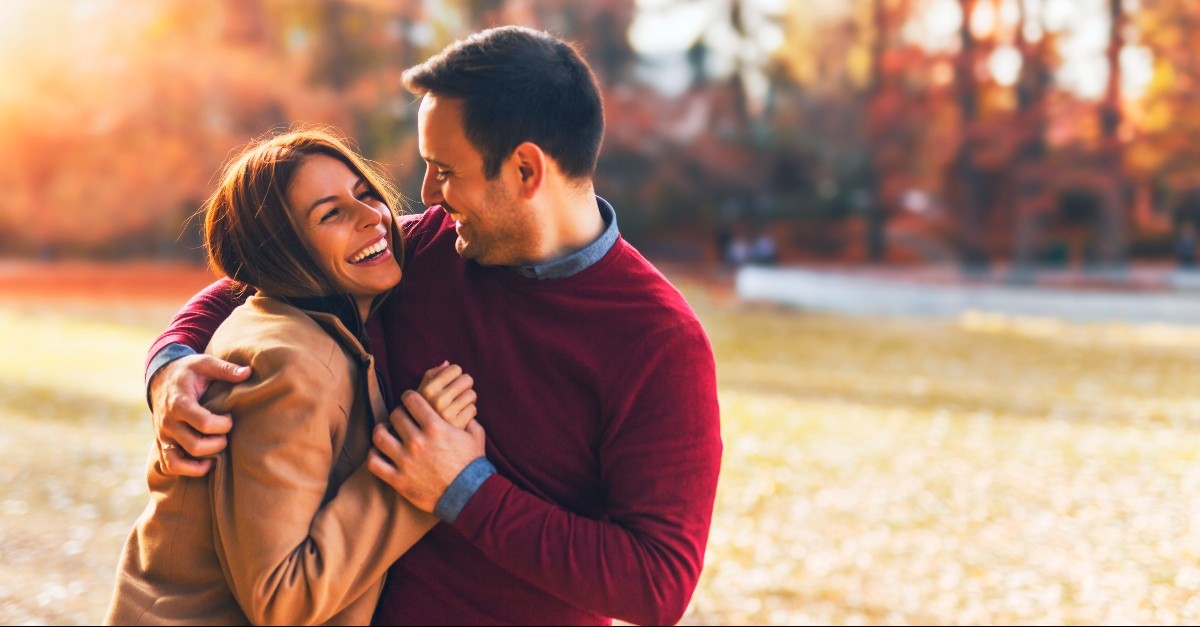 Husband and wife in a smiling embrace