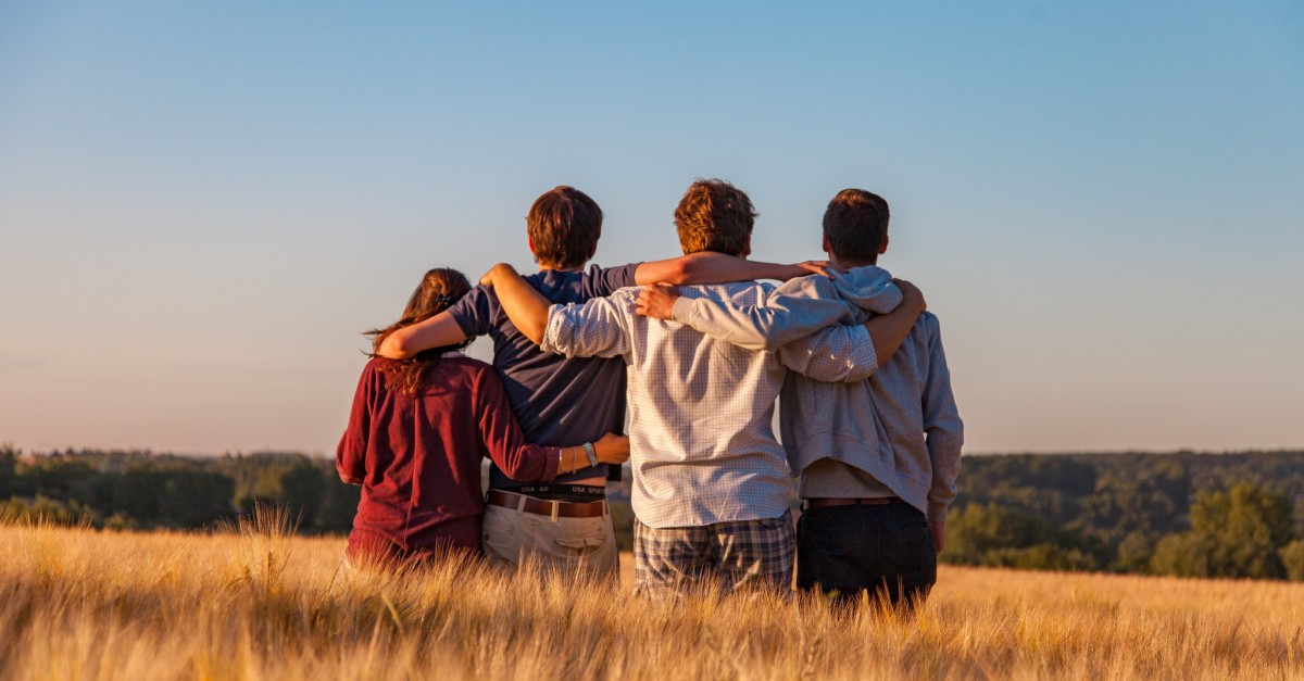 People standing in a field, a prayer for unity amid the election