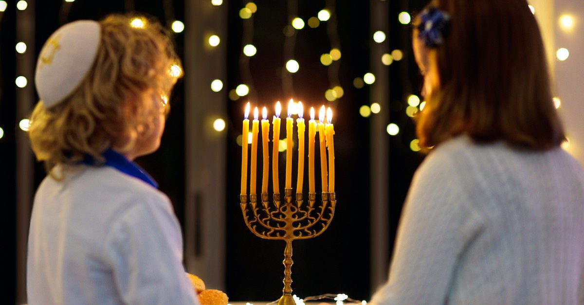 children looking at Hanukkah menorah, Jewish holidays